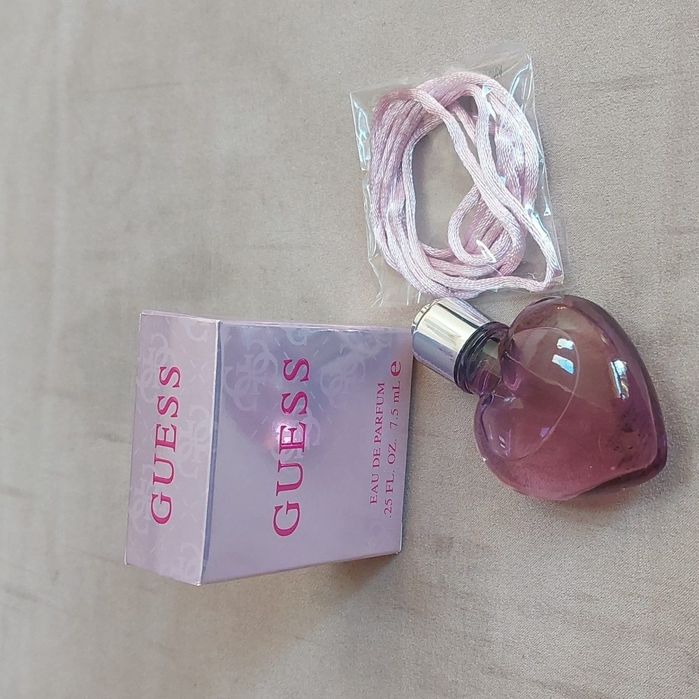 Guess Eau De Parfum necklace.